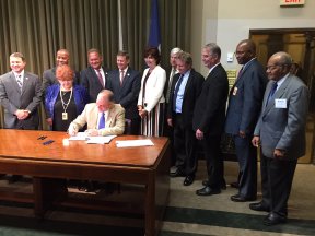 jbe_signs_cola_bill.jpg